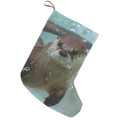 A cute Brown otter swimming in a clear blue pool Small Christmas Stocking