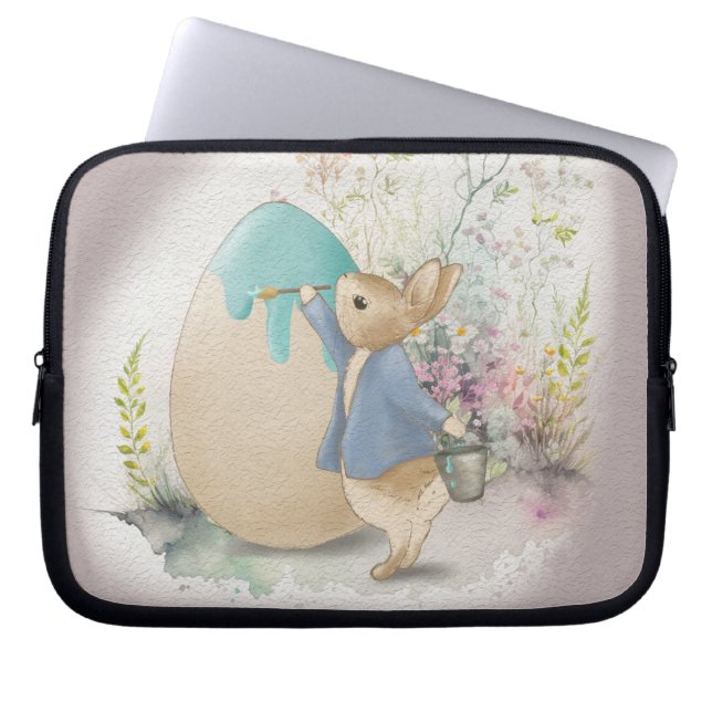 a cute Easter bunny paints an egg Laptop Sleeve (Front)