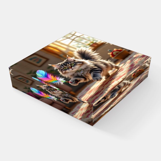 A Cute Fluffy Cat Chasing a Feather Paperweight (Angled)
