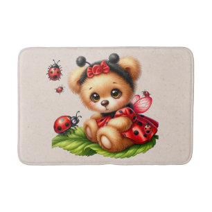 A Cute Teddy Bear Dressed Like a Ladybug Bath Mat