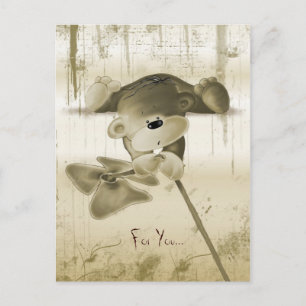A cute teddy bear with a flower - postcard