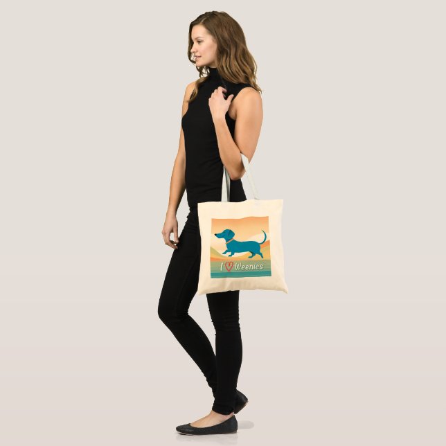 A cute tote bag with a wiener dog illustration (Front (Model))