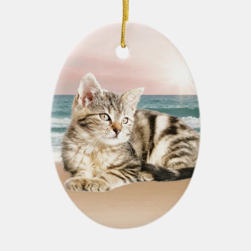 A Cuter Striped Cat Sitting on Beach with sunset Ceramic Ornament
