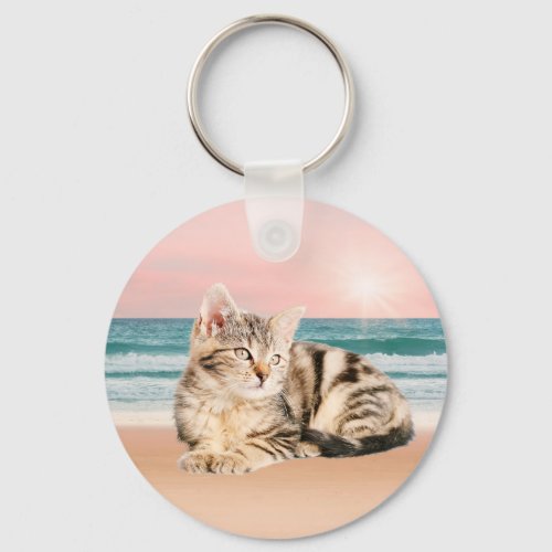 A Cuter Striped Cat Sitting on Beach with sunset Keychain