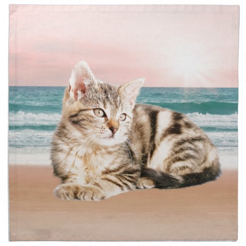 A Cuter Striped Cat Sitting on Beach with sunset Napkin