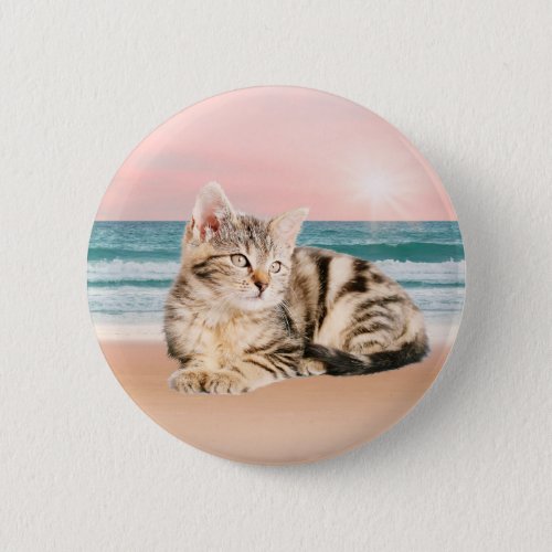 A Cuter Striped Cat Sitting on Beach with sunset Pinback Button