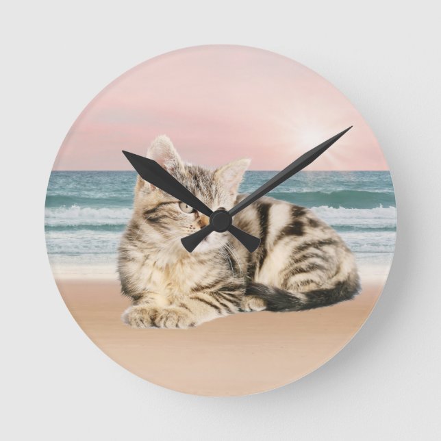 A Cuter Striped Cat Sitting on Beach with sunset Round Clock (Front)