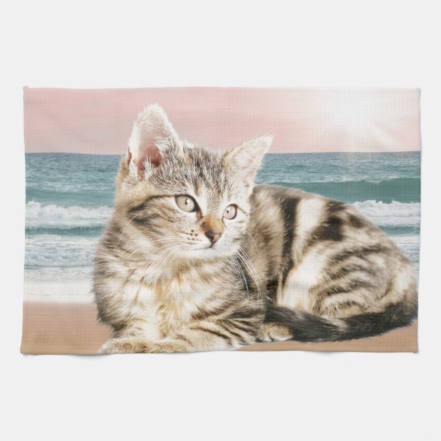 A Cuter Striped Cat Sitting on Beach with sunset Towel (Horizontal)