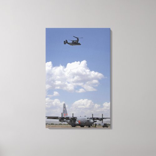 A CV_22 Osprey flies over a C_130 Hercules Canvas Print