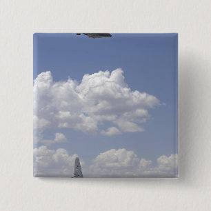 A CV-22 Osprey flies over a C-130 Hercules Pinback Button