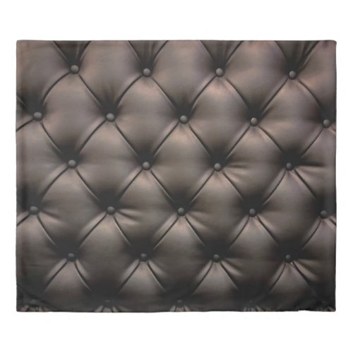 A dark leather cushion background from a car seat duvet cover