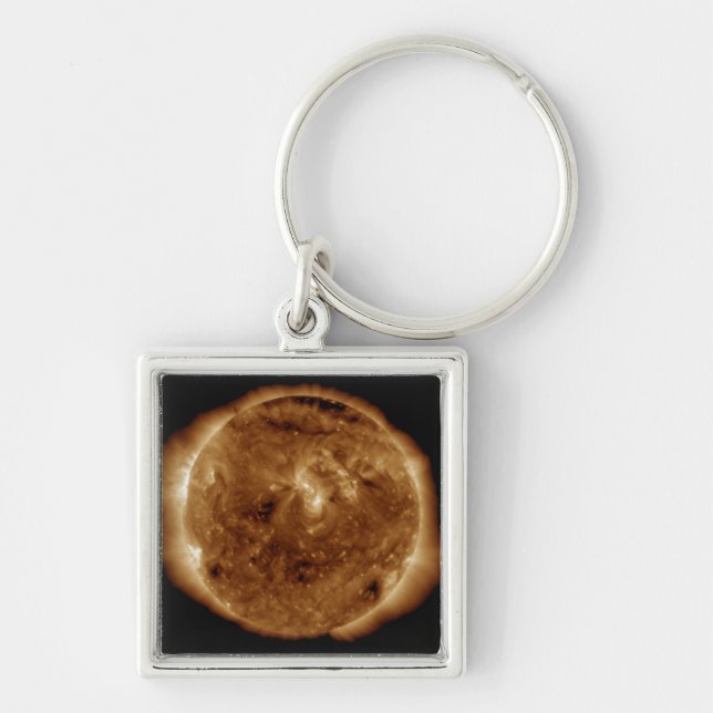 A dark rift in the sun's atmosphere keychain (Front)