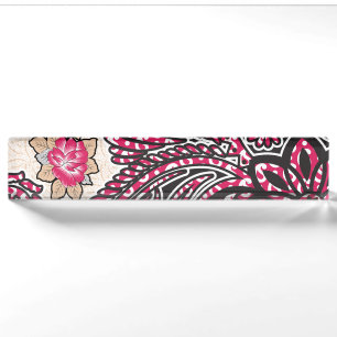 A decorative paisley design with vivid red and pin desk name plate