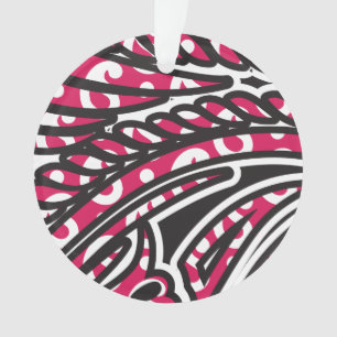 A decorative paisley design with vivid red and pin ornament