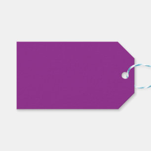 A deep purple background accented by a bright whit gift tags