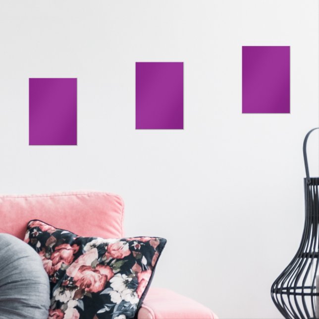 A deep purple background accented by a bright whit wall art sets (Livingroom)
