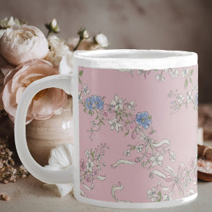 a delicate bouquet of wildflowers on a pink backgr giant coffee mug