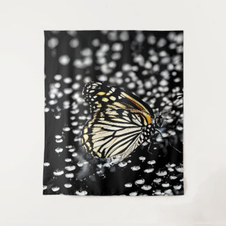 A delicate butterfly with drops of dew tapestry