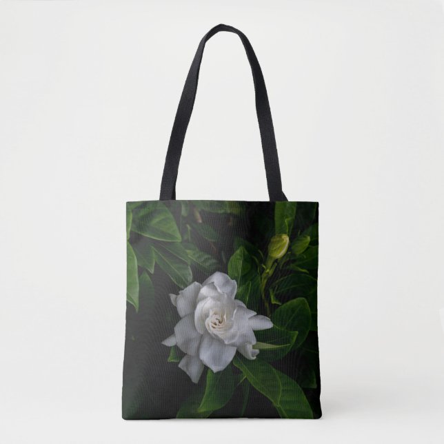 A delicate white flower blooms  tote bag (Front)
