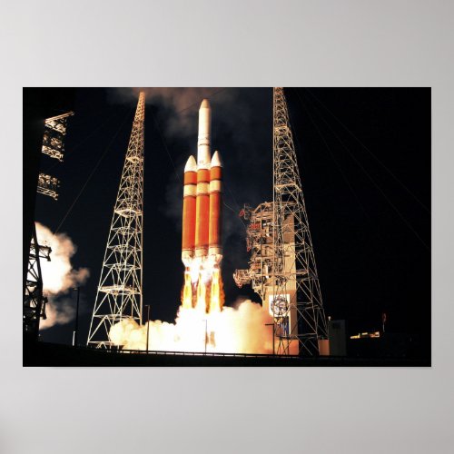 A Delta IV Heavy rocket lifts off Poster