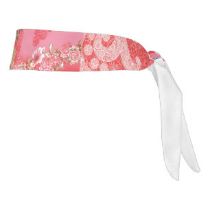 a design of a pink and gold background with a red tie headband