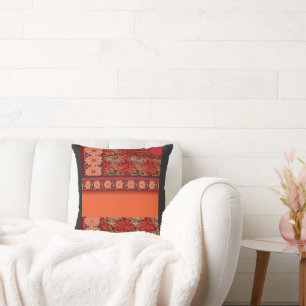 a design of a red and gold pattern throw pillow
