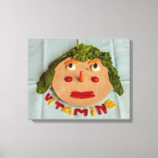a face of vegetables on wrapped canvas