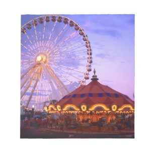 A ferris wheel and carousel at the Navy Pier in Notepad