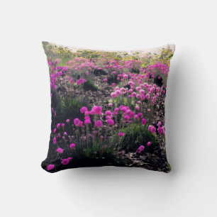 A field of pink flowers throw pillow