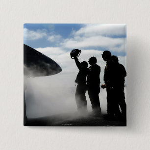 A flight deck crew member button