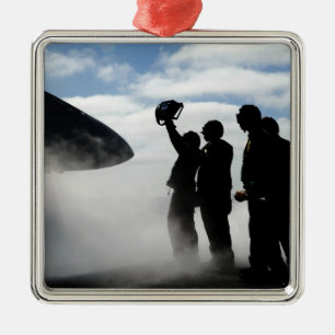 A flight deck crew member metal ornament