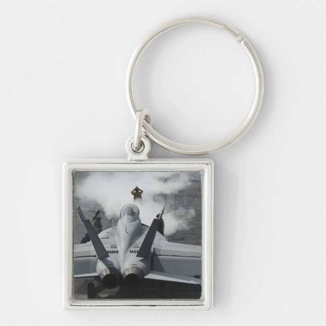 A flight deck director signals an F/A-18F Keychain (Front)