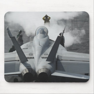 A flight deck director signals an F/A-18F Mouse Pad