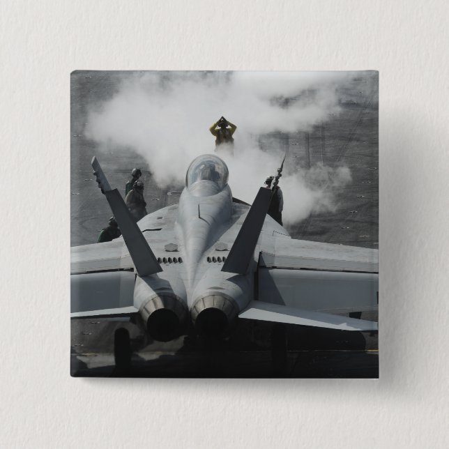 A flight deck director signals an F/A-18F Pinback Button (Front)