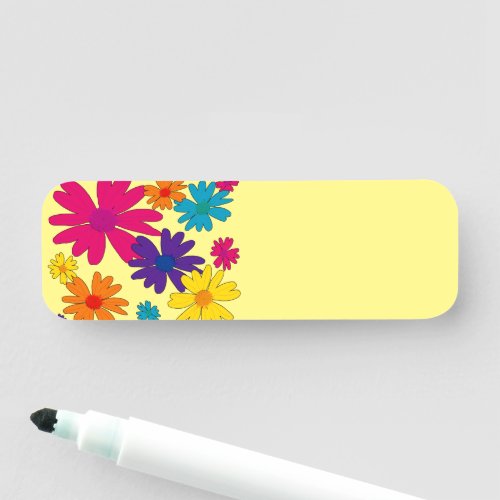 A floral bed of daisy flowers  name tag