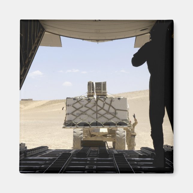 A forklift loads cargo onto a C-130 Hercules Magnet (Front)