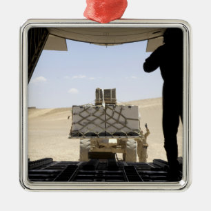 A forklift loads cargo onto a C-130 Hercules Metal Ornament