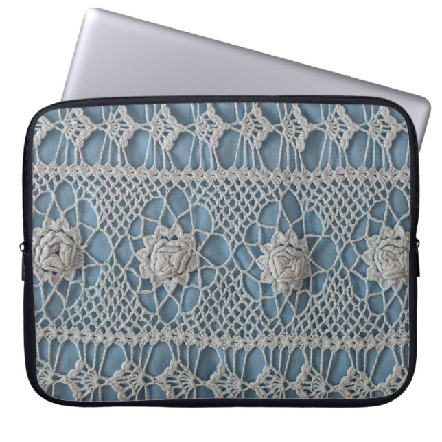 A fragment of a wide lace insert contains small wh laptop sleeve (Front)