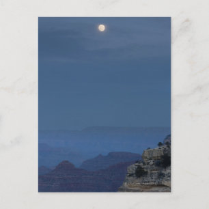 A full moon rises through a dusk sky at Hopi Postcard