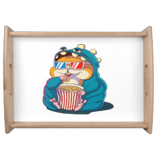 A funny hamster wearing glasses eats popcorn serving tray