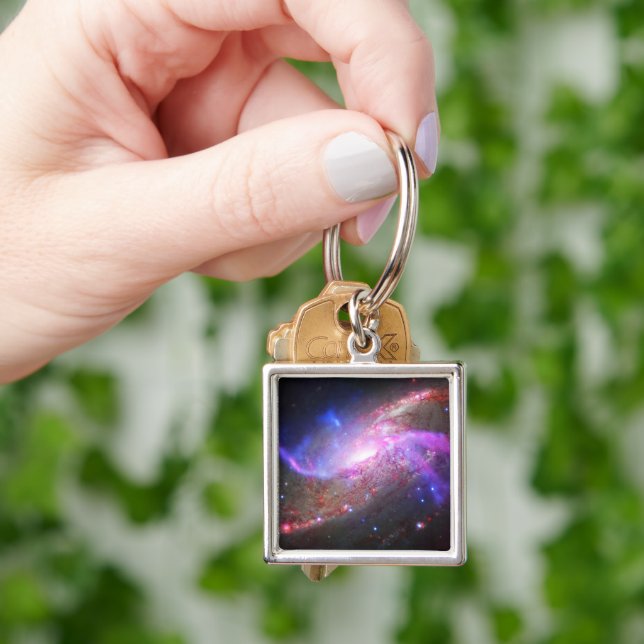 A Galactic Light Show In Spiral Galaxy Ngc 4258. Keychain (Hand)