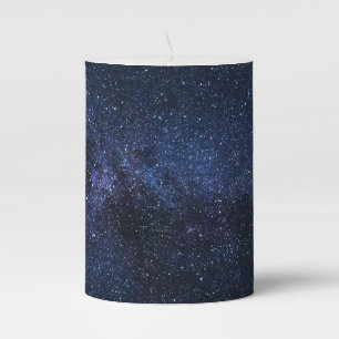 A galaxy of stars in the night sky pillar candle