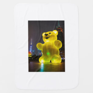 A giant yellow gummy bear baby blanket