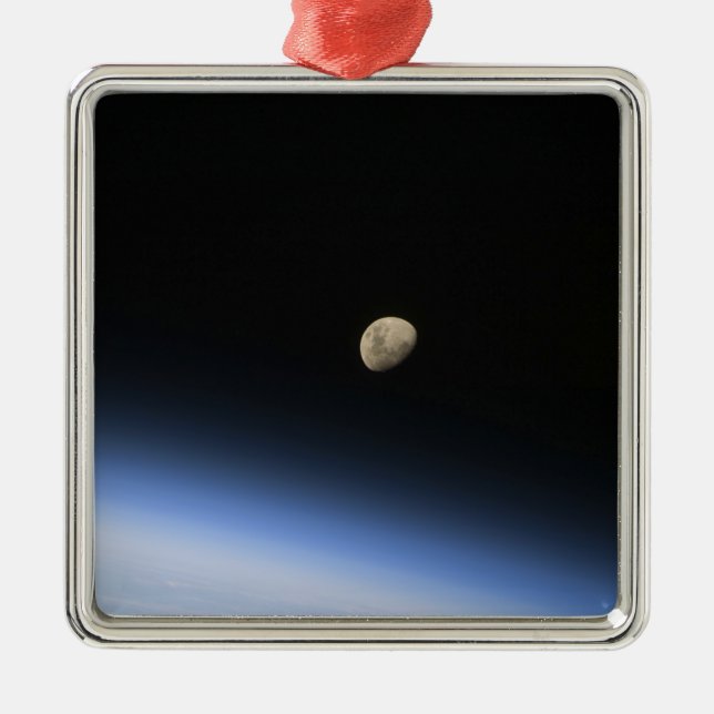 A gibbous moon visible above Earth's atmosphere 2 Metal Ornament (Front)