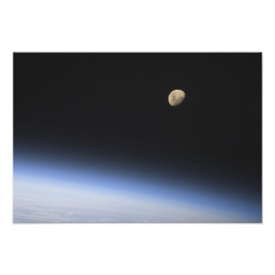 A gibbous moon visible above Earth's atmosphere 2 Photo Print
