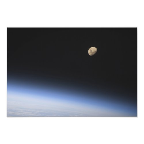 A gibbous moon visible above Earths atmosphere 2 Photo Print