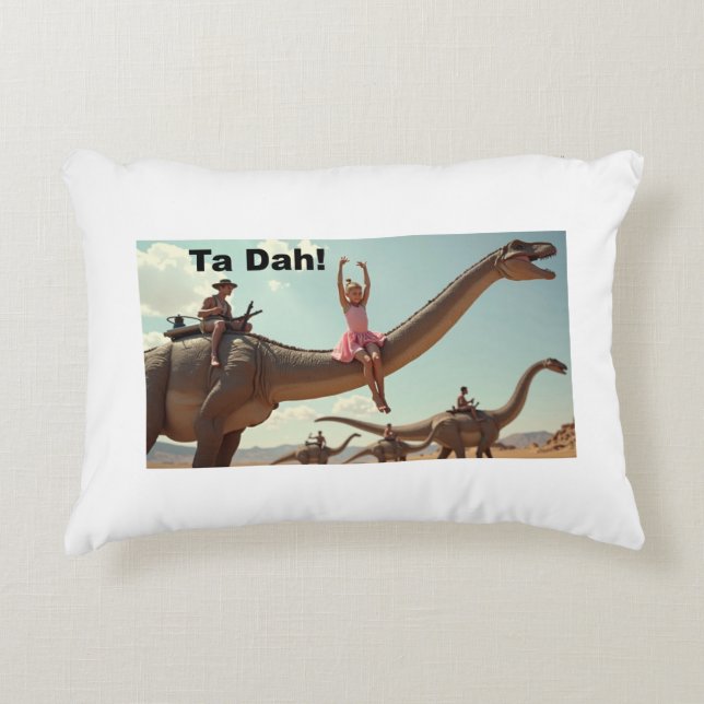 A girl ballerina poses on a dino accent pillow (Front)