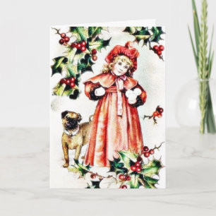 A girl holding ball like thing in hand and a dog l holiday card