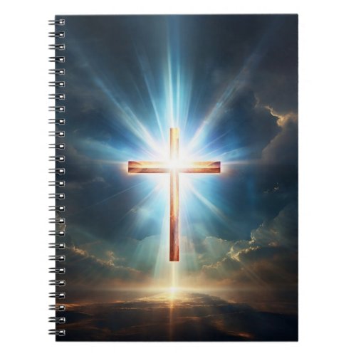 A golden cross floating in the sky and emits light notebook