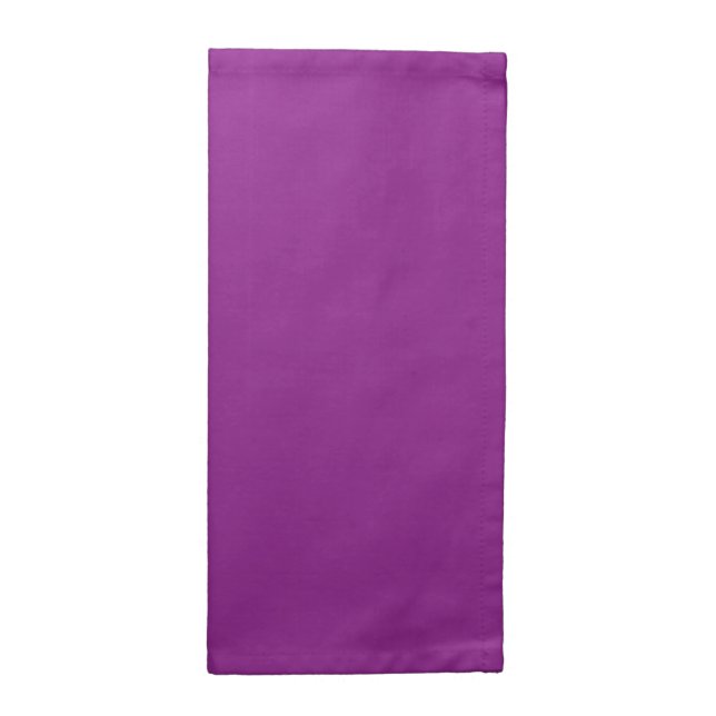 A gradient background blending shades of pink and  cloth napkin (Half Fold)